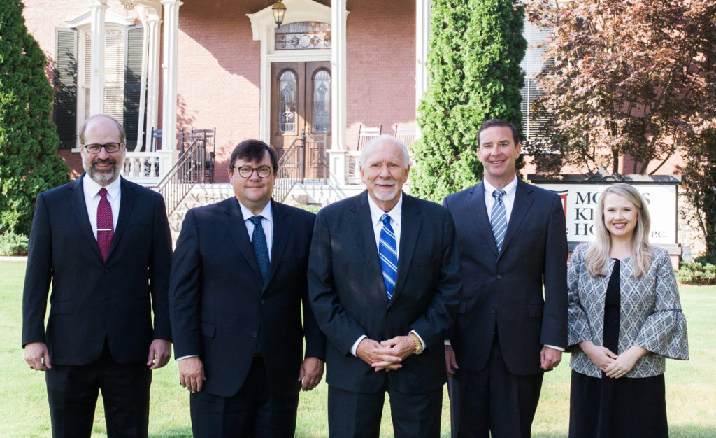 morris king hodge team in front of office building