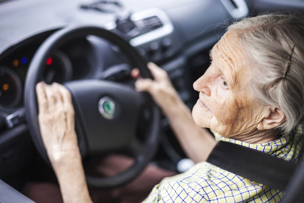 eldery women pulled over in drivers seat