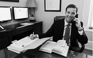 attorney at desk on phone