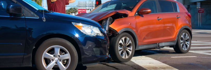 after image of a head on collision of two cars at an intersection