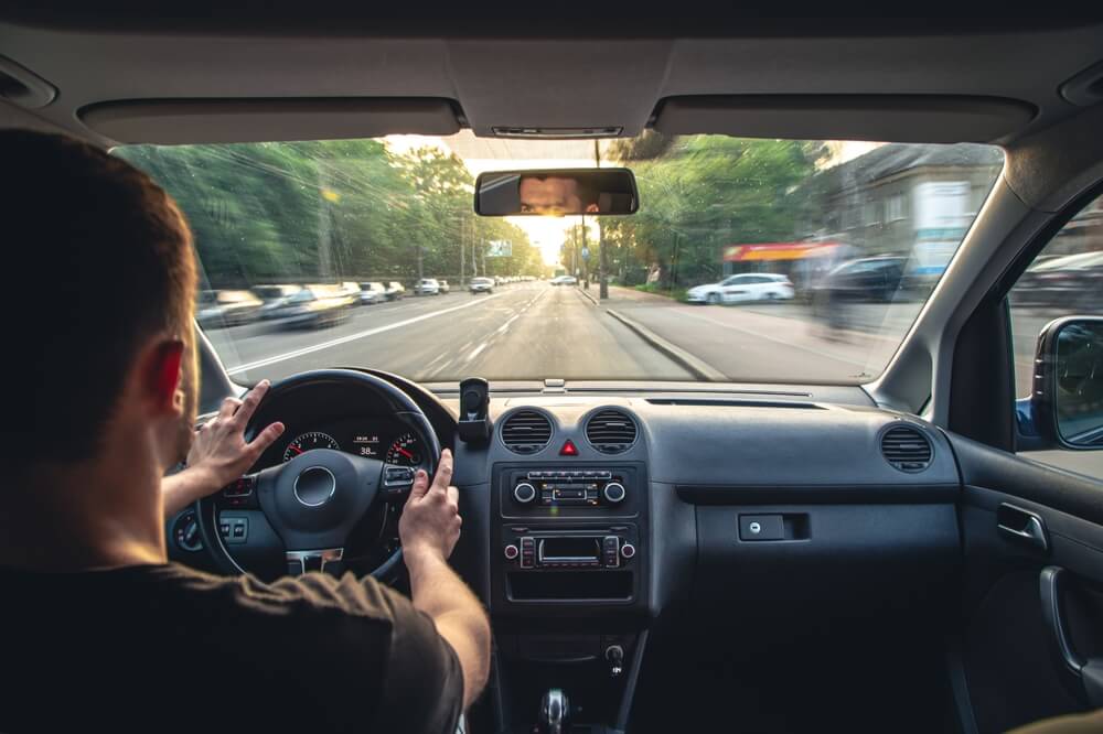 Hands on the wheel when driving at high speed from inside the car.