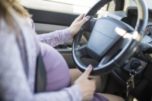 pregnant woman driving car