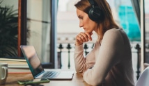 Woman on a desk with a laptop