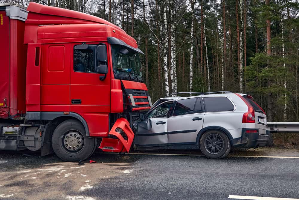 Truck collides head-on with a car
