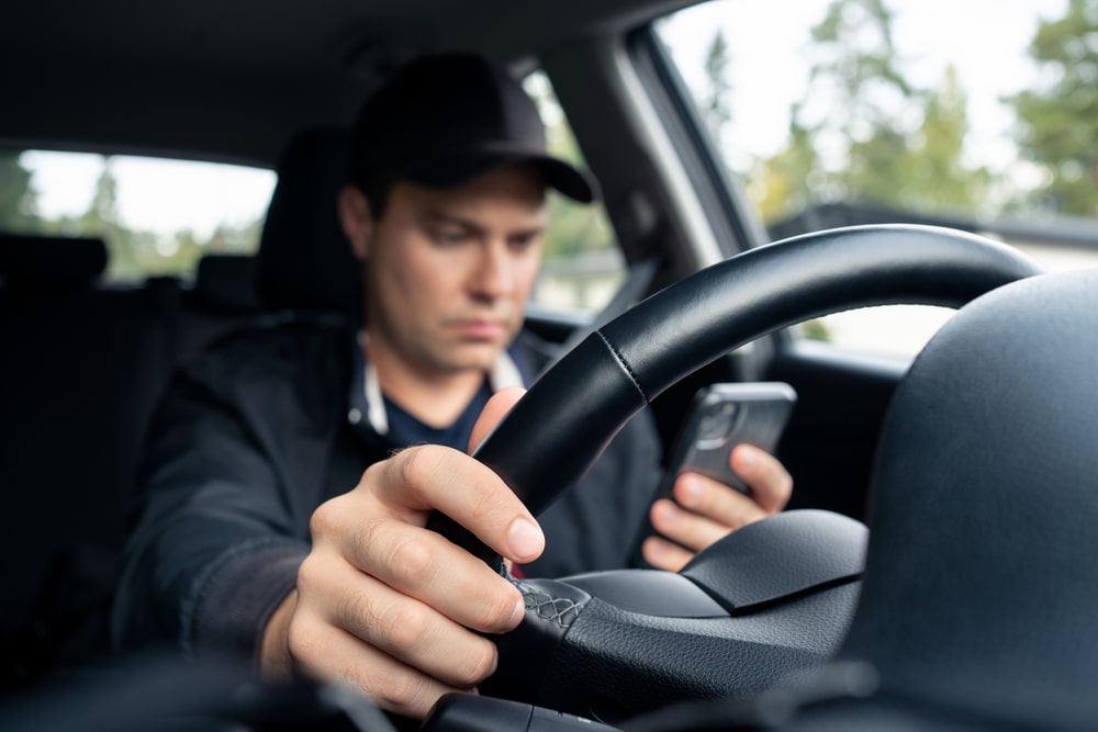 Car driver distracted while driving
